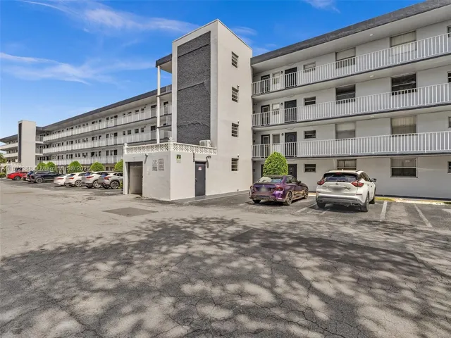 a aerial view of a city with lots of residential buildings and ocean view