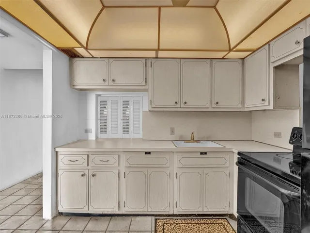 a view of a refrigerator in a kitchen