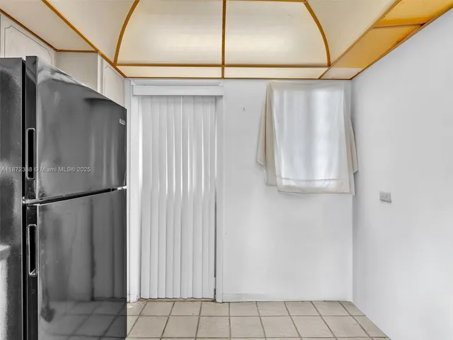 a bathroom with a shower and a shower curtain