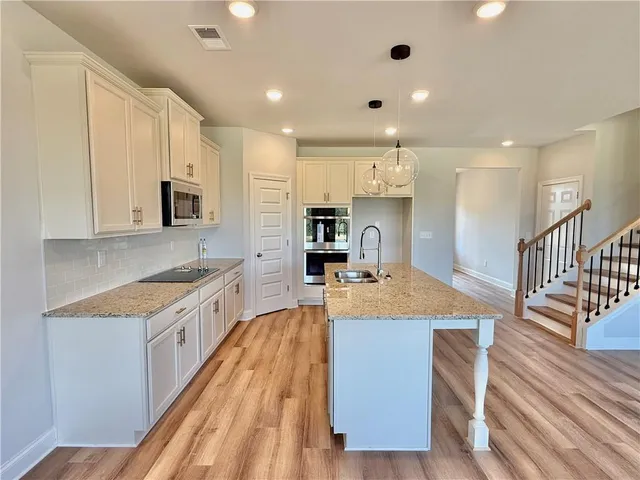 a large kitchen with cabinets