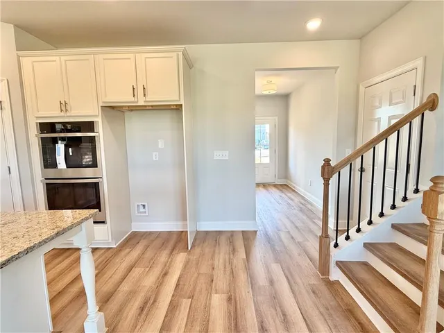 a view of a kitchen from the hallway