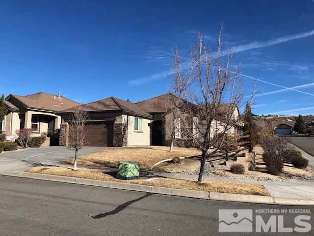 1310 Meridian Ranch Drive Reno, NV 89523 - Photo 1 of 13 a front view of a house with a yard
