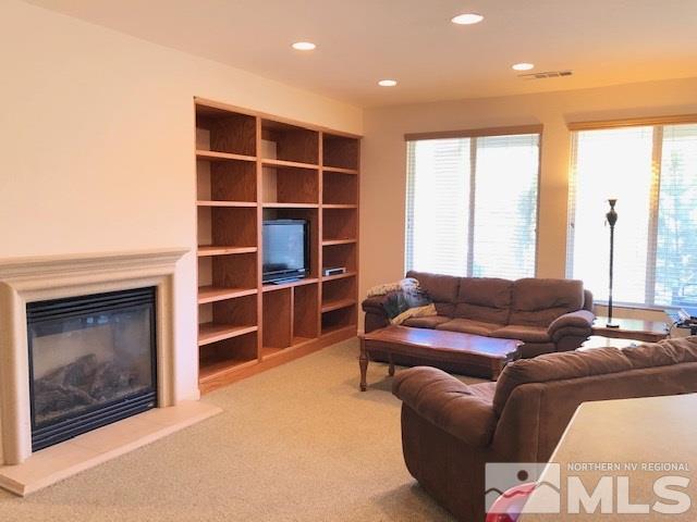 1310 Meridian Ranch Drive Reno, NV 89523 - Photo 2 of 13 a living room with furniture and a fireplace