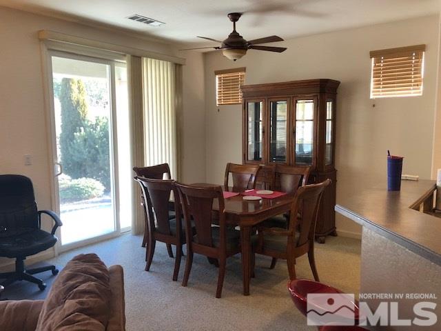 1310 Meridian Ranch Drive Reno, NV 89523 - Photo 4 of 13 a view of a dining room with furniture window and outside view