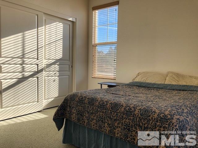 1310 Meridian Ranch Drive Reno, NV 89523 - Photo 8 of 13 a bedroom with a bed and a window