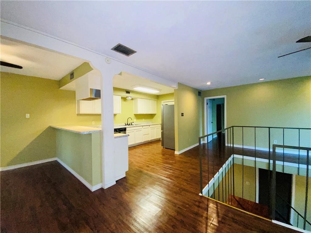 310 Sunset Boulevard Portland, TX 78374 - Photo 5 of 18 a hallway with wooden floor
