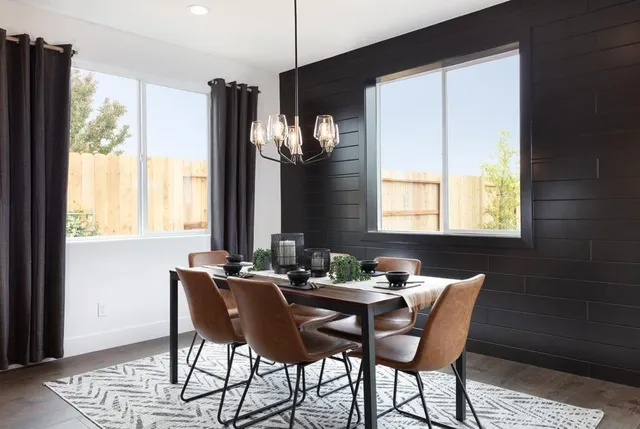 a dining room with furniture and window