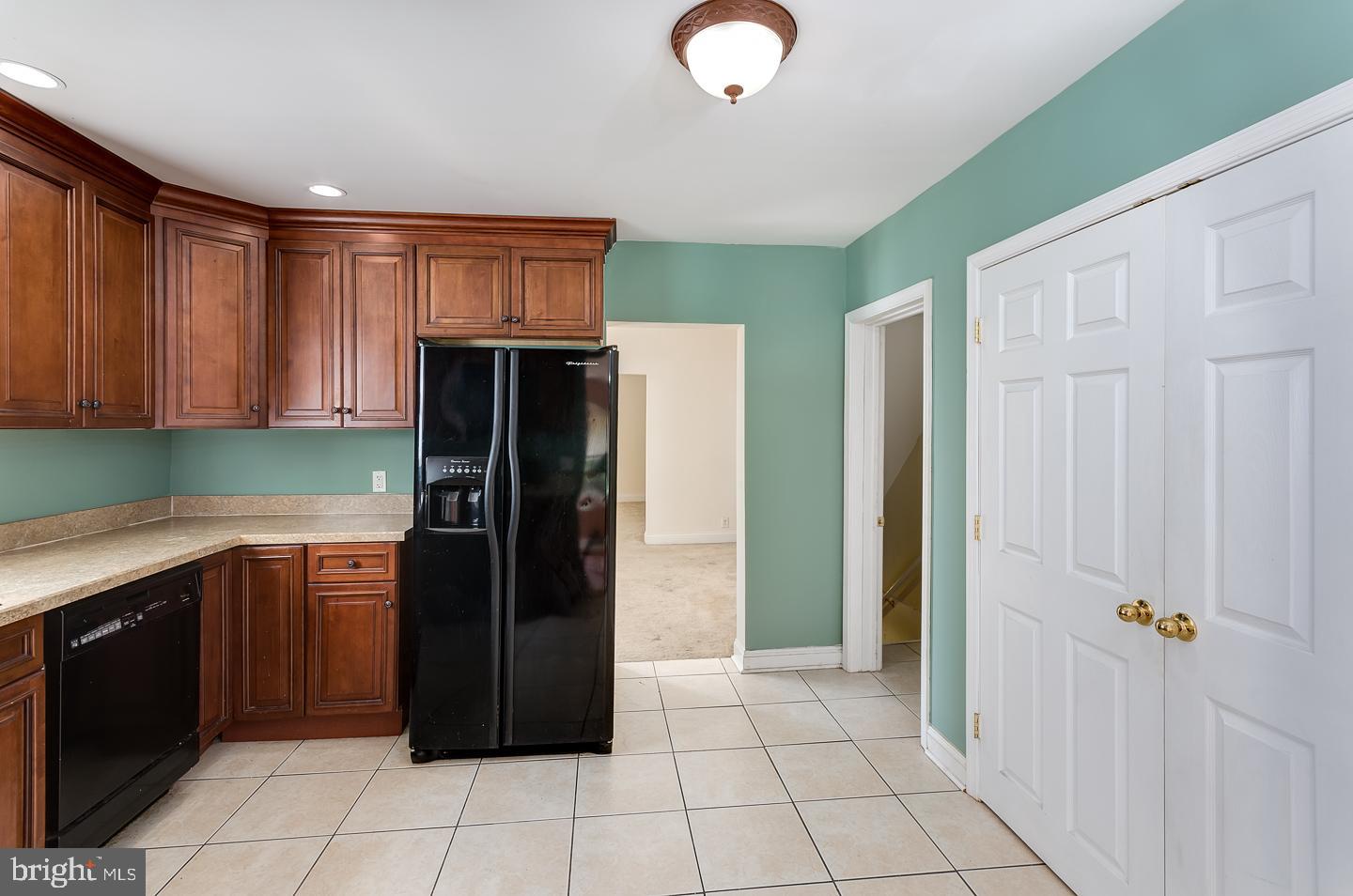 569 South Fairview Street Riverside, NJ 08075 - Photo 11 of 26 a kitchen with stainless steel appliances granite countertop a refrigerator and a sink