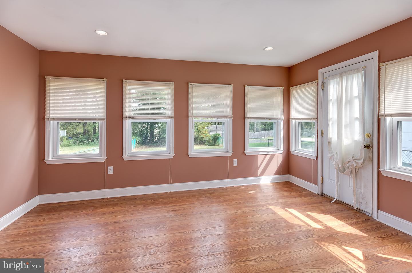 569 South Fairview Street Riverside, NJ 08075 - Photo 15 of 26 a view of an empty room with wooden floor and a window