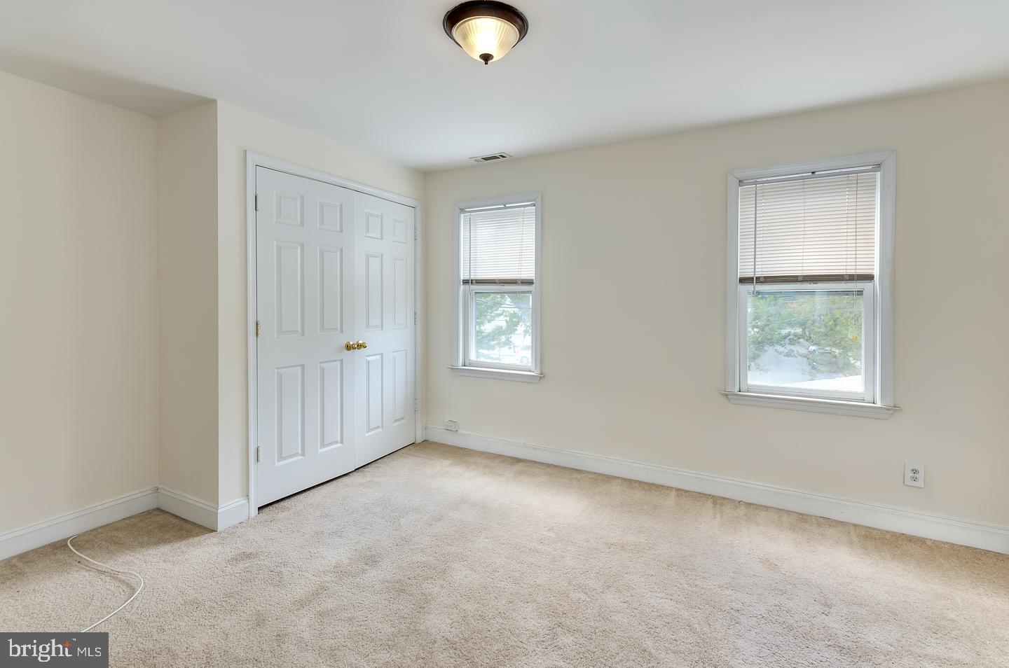 569 South Fairview Street Riverside, NJ 08075 - Photo 17 of 26 an empty room with closet and window