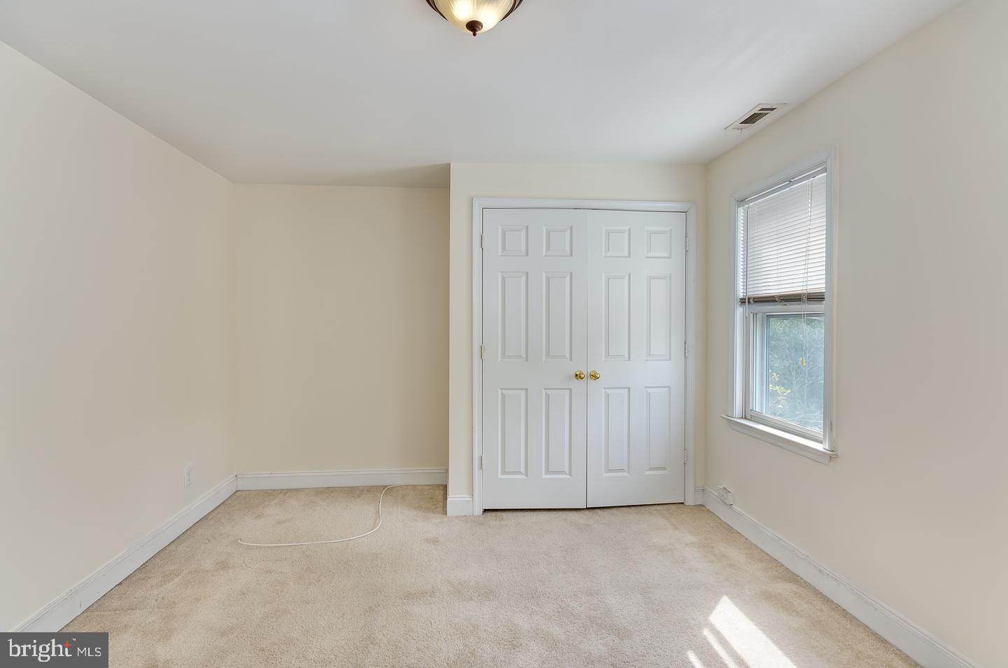 569 South Fairview Street Riverside, NJ 08075 - Photo 18 of 26 an empty room with windows and closet
