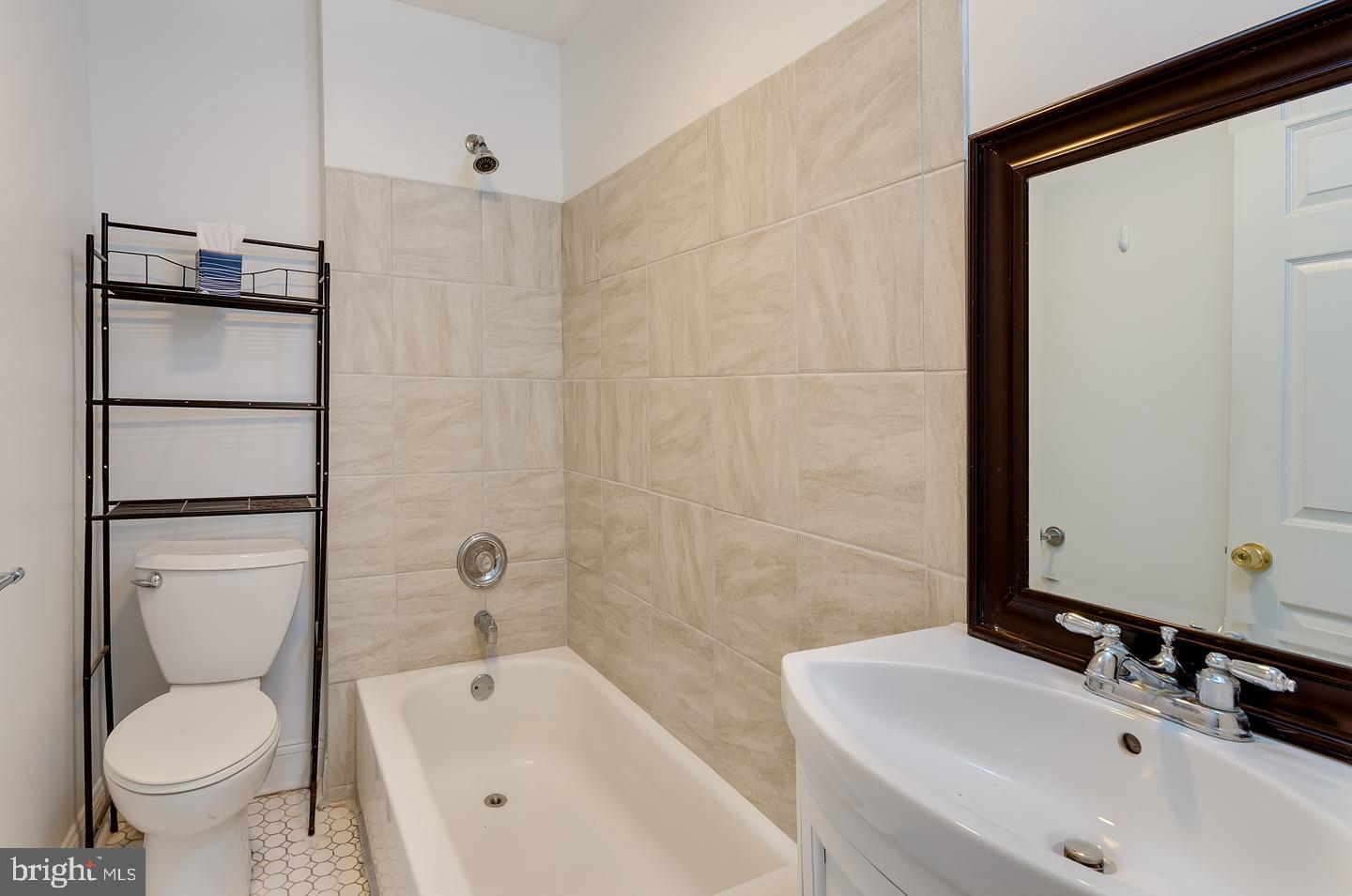 569 South Fairview Street Riverside, NJ 08075 - Photo 21 of 26 a bathroom with a sink toilet and shower