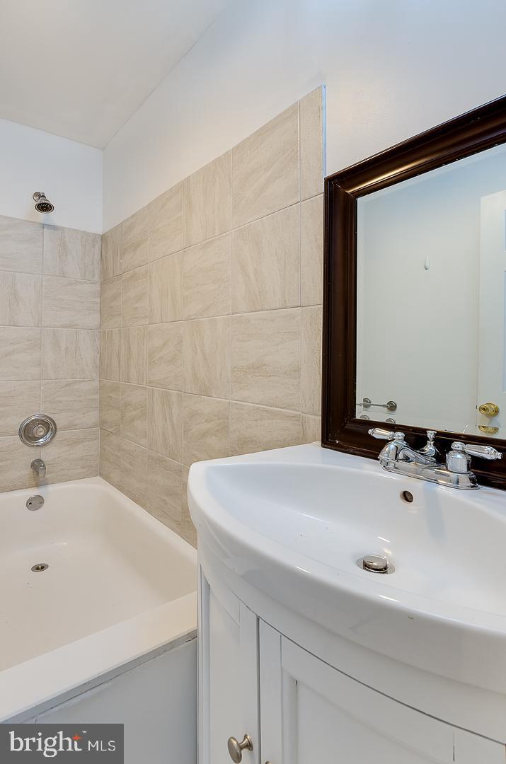 569 South Fairview Street Riverside, NJ 08075 - Photo 22 of 26 a bathroom with a sink and a bathtub