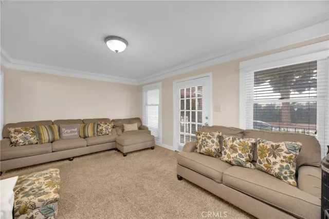 a living room with a couch and a window