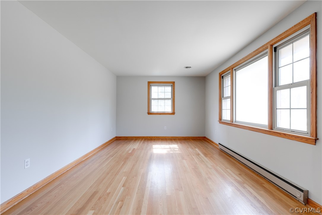 4440 Treely Road Chester, VA 23831 - Photo 11 of 39 an empty room with wooden floor and windows