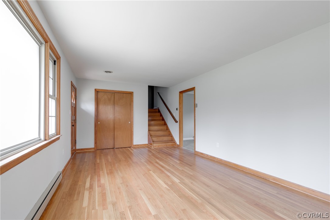 4440 Treely Road Chester, VA 23831 - Photo 12 of 39 a view of an empty room with wooden floor and a window