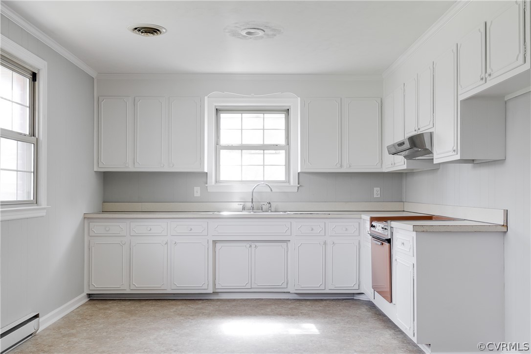 4440 Treely Road Chester, VA 23831 - Photo 16 of 39 a kitchen with white cabinets appliances a sink and a window