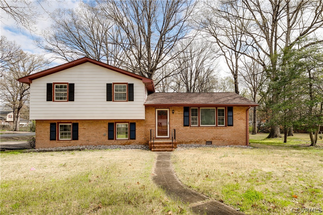 4440 Treely Road Chester, VA 23831 - Photo 2 of 39 a front view of a house with a yard