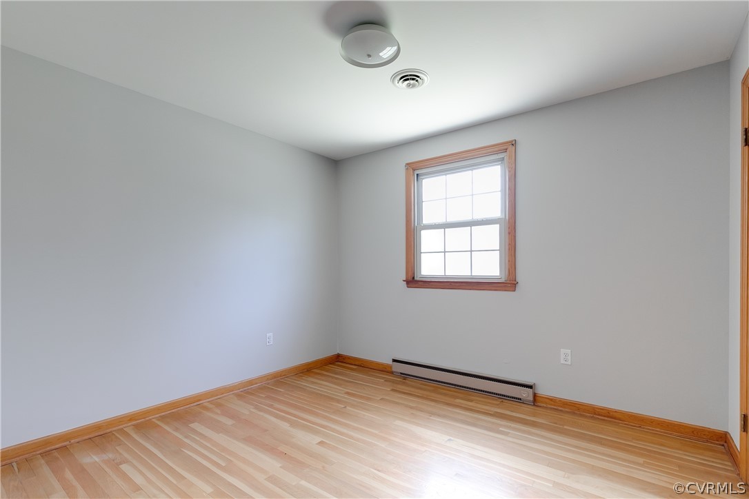 4440 Treely Road Chester, VA 23831 - Photo 21 of 39 an empty room with wooden floor and windows