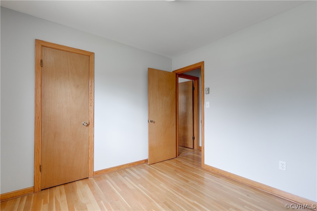 4440 Treely Road Chester, VA 23831 - Photo 22 of 39 a view of an empty room with wooden floor and closet