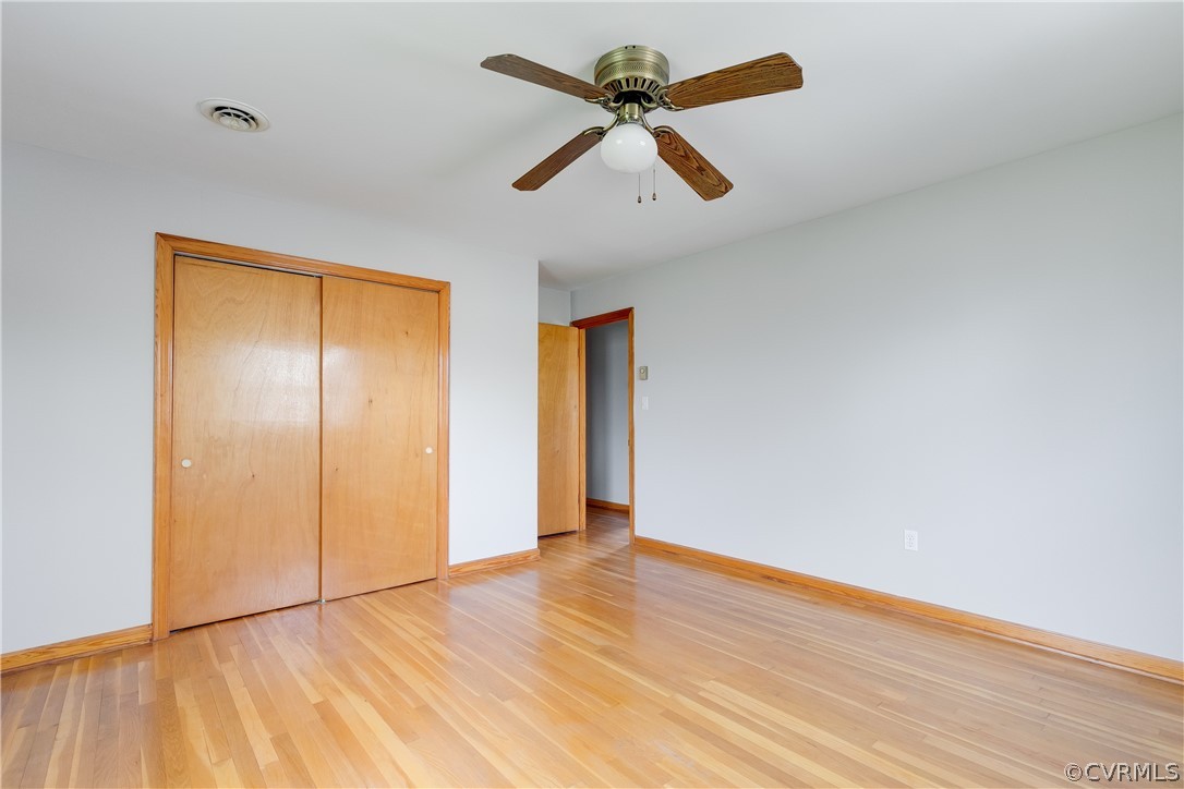 4440 Treely Road Chester, VA 23831 - Photo 26 of 39 an empty room with wooden floor and windows