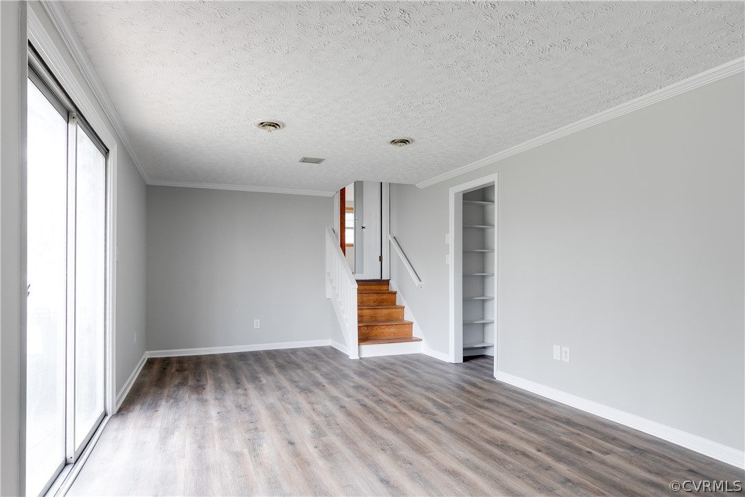 4440 Treely Road Chester, VA 23831 - Photo 33 of 39 a view of an empty room with wooden floor and windows
