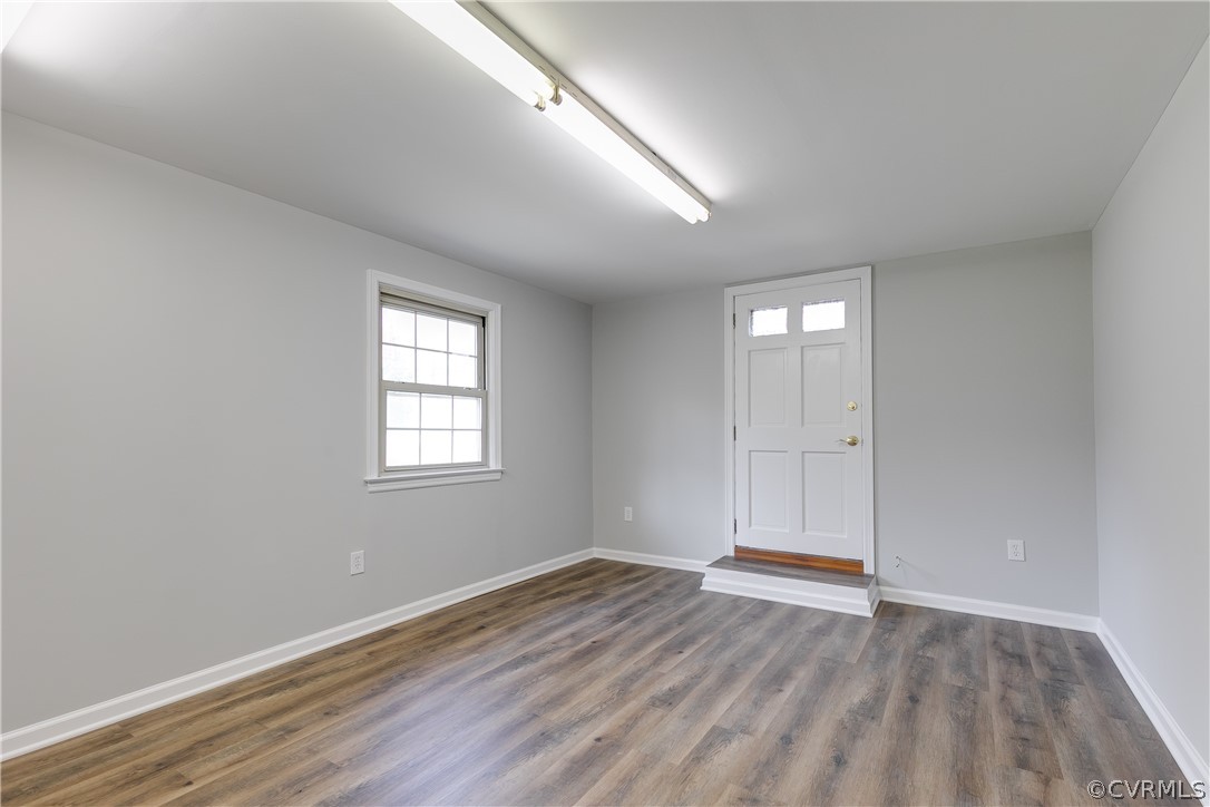 4440 Treely Road Chester, VA 23831 - Photo 38 of 39 an empty room with wooden floor and windows