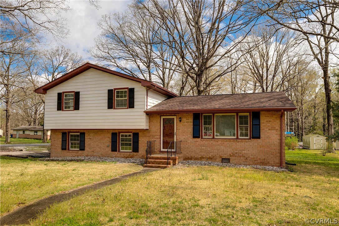 4440 Treely Road Chester, VA 23831 - Photo 4 of 39 a front view of a house with a yard