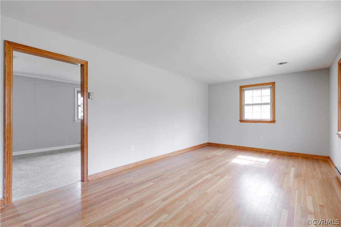 4440 Treely Road Chester, VA 23831 - Photo 10 of 39 an empty room with wooden floor and windows