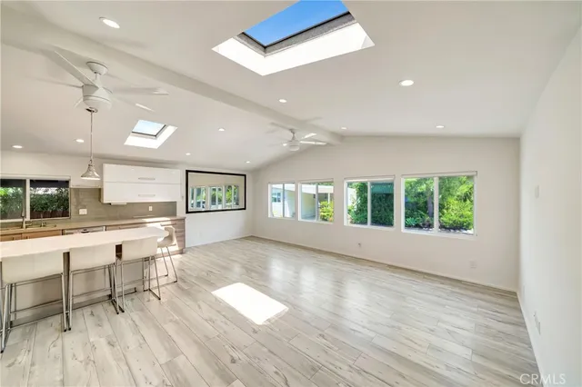 a kitchen with a sink and a stove top oven