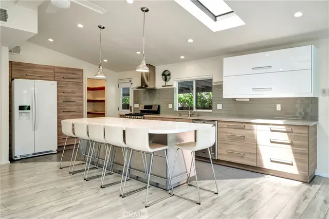 a front view of a house with a yard and street view