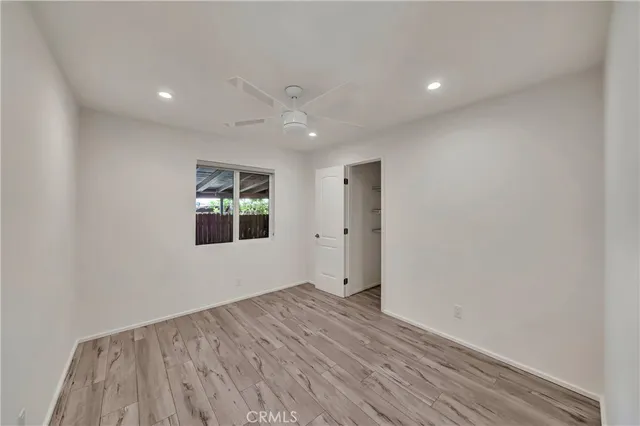 a bathroom with a granite countertop double vanity sink and a mirror