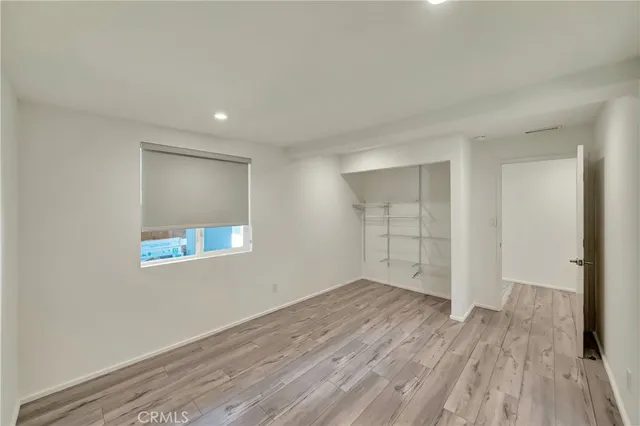 a spacious bathroom with a toilet sink and mirror