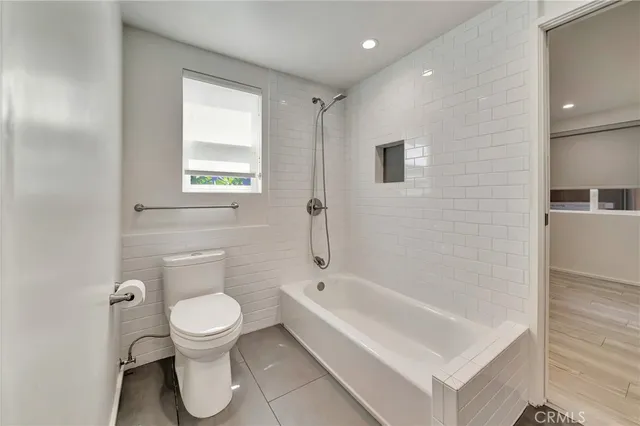 a bathroom with a double vanity sink mirror and shower