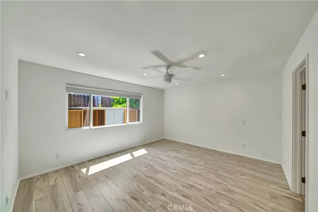 a view of a room with wooden walls and stairs