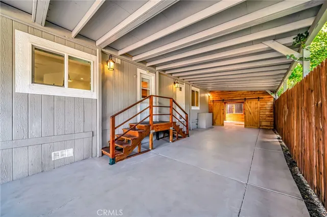 a living room with lots of furniture and wooden floor