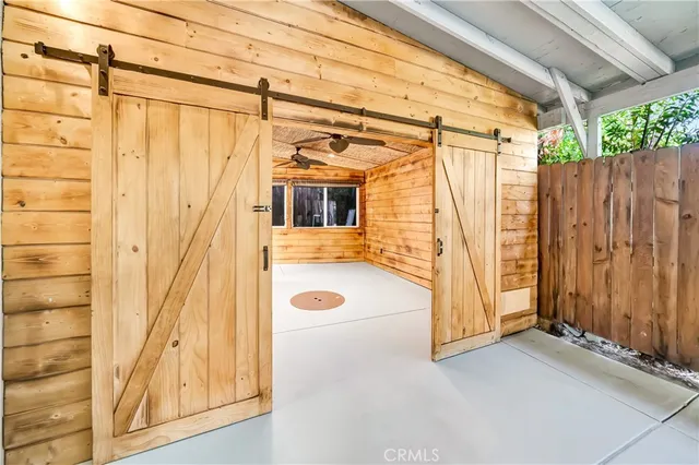 a large kitchen with stainless steel appliances granite countertop a stove and a sink