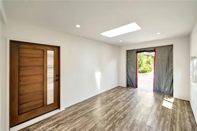 a large kitchen with lots of counter space dining table and stainless steel appliances
