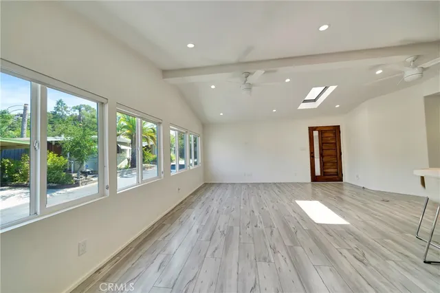 a kitchen with stainless steel appliances kitchen island granite countertop a stove and a refrigerator