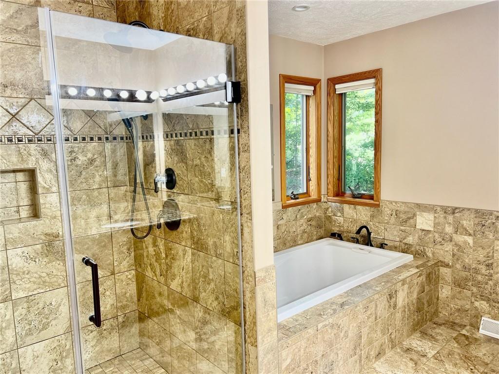 657 Fallecker Road Butler, PA 16002 - Photo 11 of 25 a bathroom with a granite countertop sink and a mirror