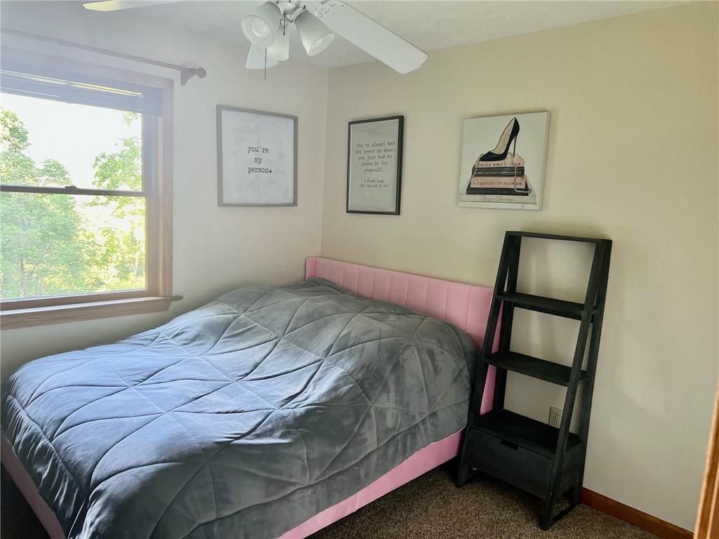 657 Fallecker Road Butler, PA 16002 - Photo 14 of 25 a bedroom with a bed and a window