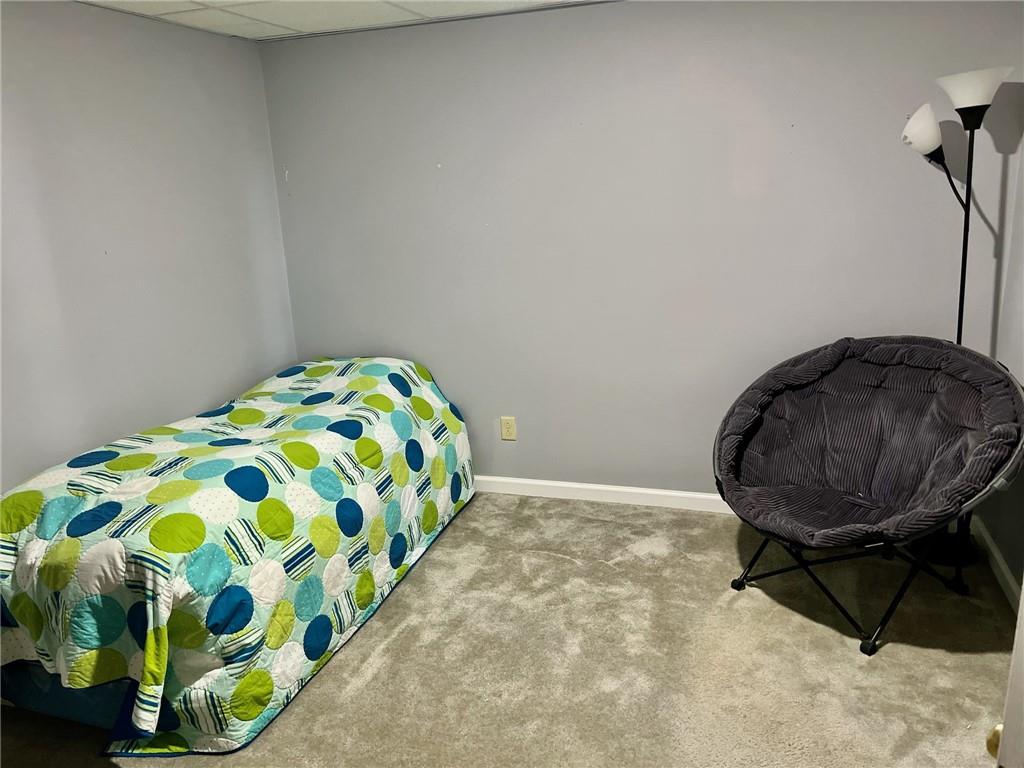 657 Fallecker Road Butler, PA 16002 - Photo 15 of 25 a bedroom with a bed and a chair