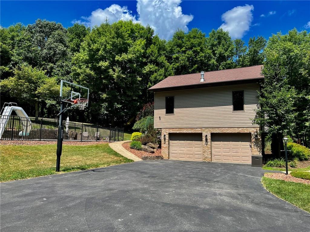 657 Fallecker Road Butler, PA 16002 - Photo 20 of 25 a view of a house with a backyard