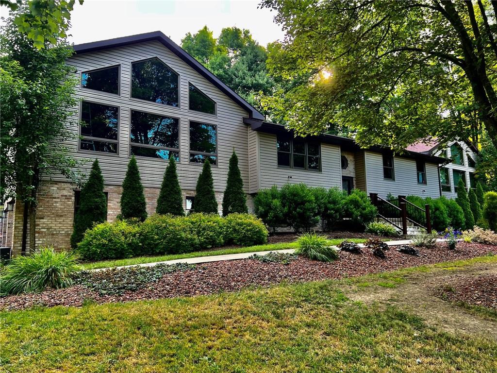 657 Fallecker Road Butler, PA 16002 - Photo 2 of 25 a front view of a house with garden