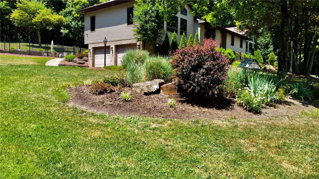 657 Fallecker Road Butler, PA 16002 - Photo 25 of 25 a view of a garden with a house