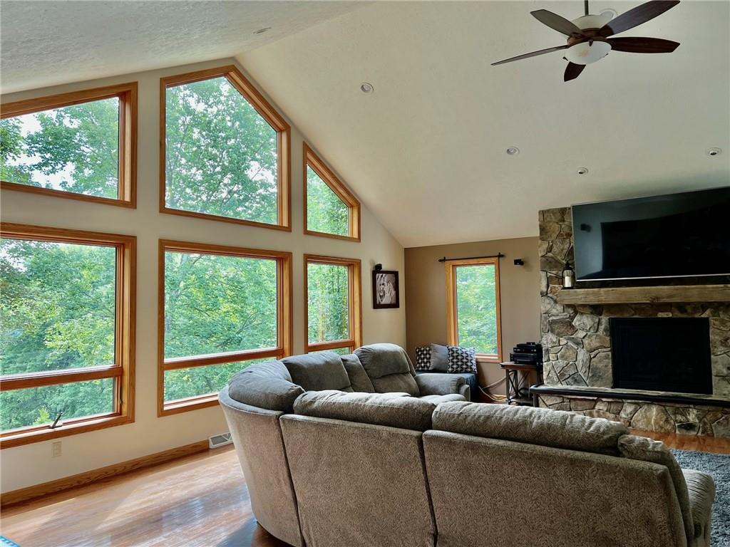 657 Fallecker Road Butler, PA 16002 - Photo 3 of 25 a living room with furniture a flat screen tv and a fireplace