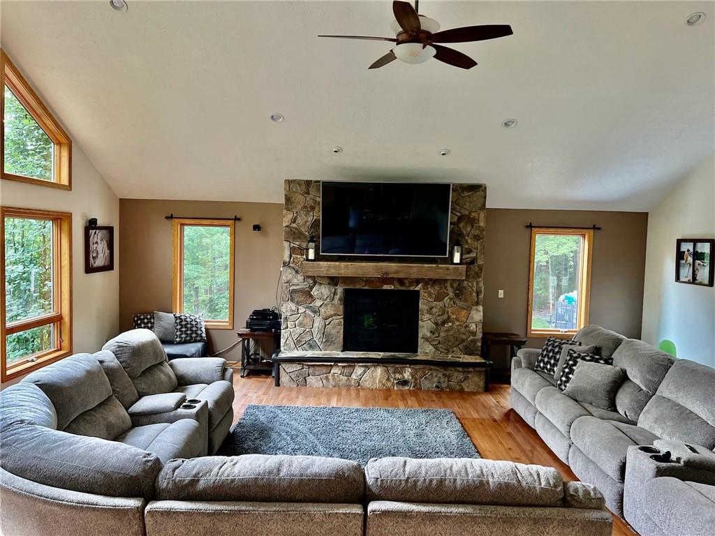 657 Fallecker Road Butler, PA 16002 - Photo 4 of 25 a living room with fireplace furniture and a flat screen tv