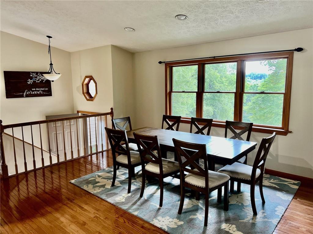 657 Fallecker Road Butler, PA 16002 - Photo 5 of 25 a view of a dining room and livingroom with furniture window and wooden floor