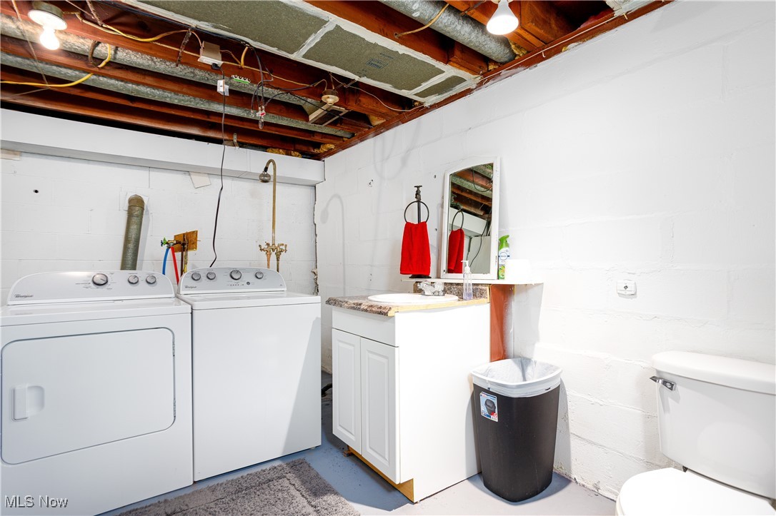 1153 Krumroy Road Akron, OH 44306 - Photo 26 of 26 Laundry area featuring sink and washing machine and dryer