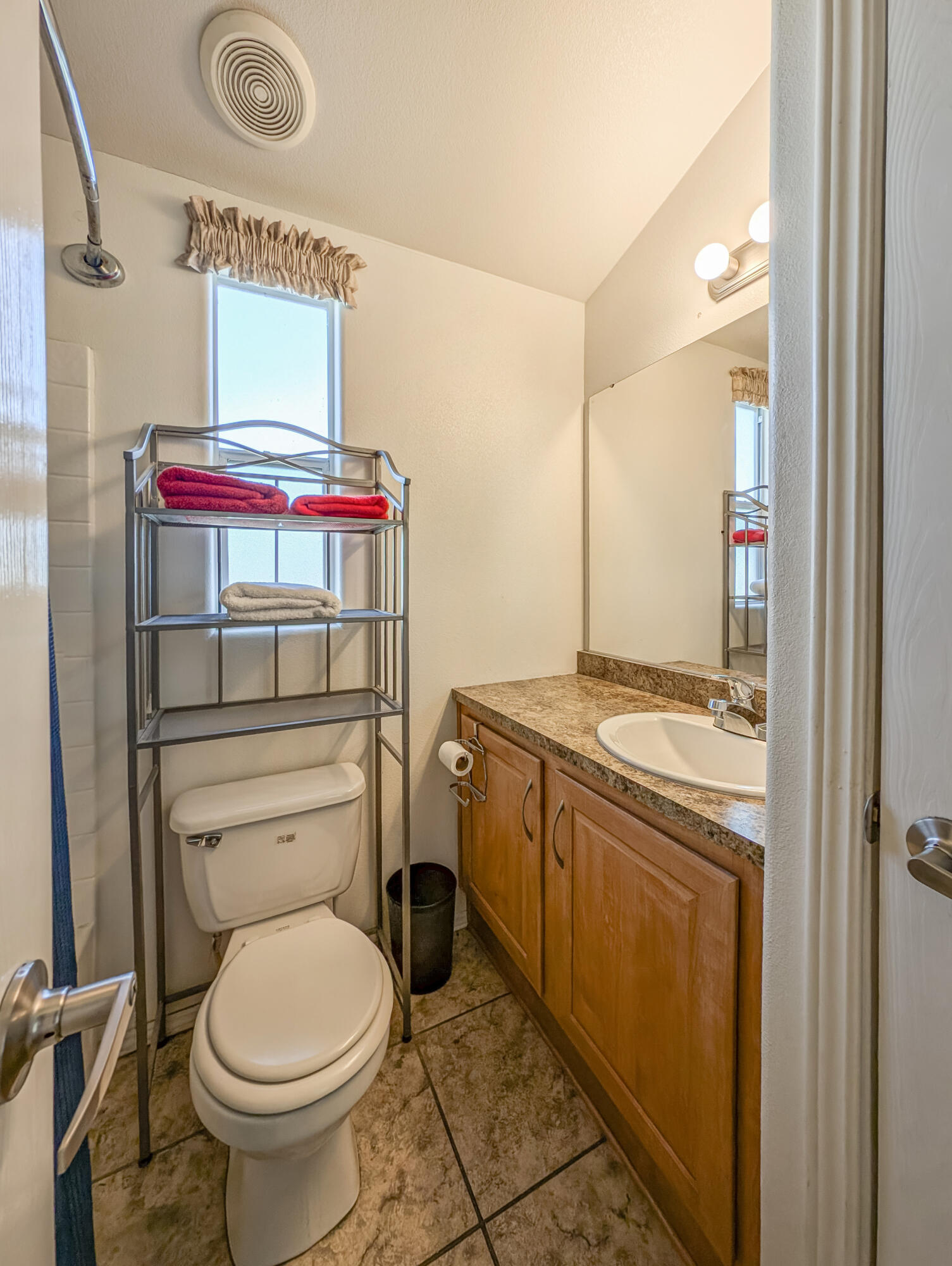 70200 Dillon Road, Unit 350 Desert Hot Springs, CA 92241 - Photo 12 of 22 a bathroom with a sink toilet and shower